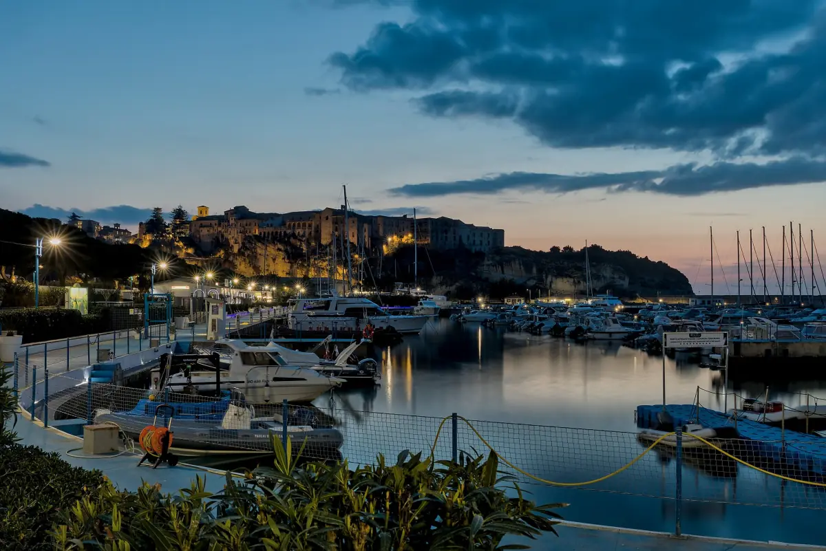 Boats in the marina of Tropea at dusk